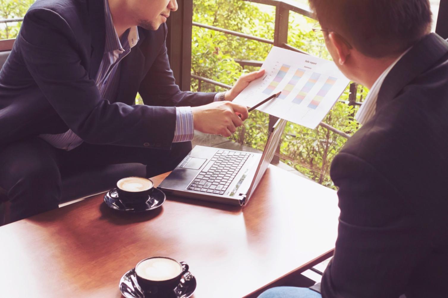 Students engaged in practical budget monitoring session with real financial data